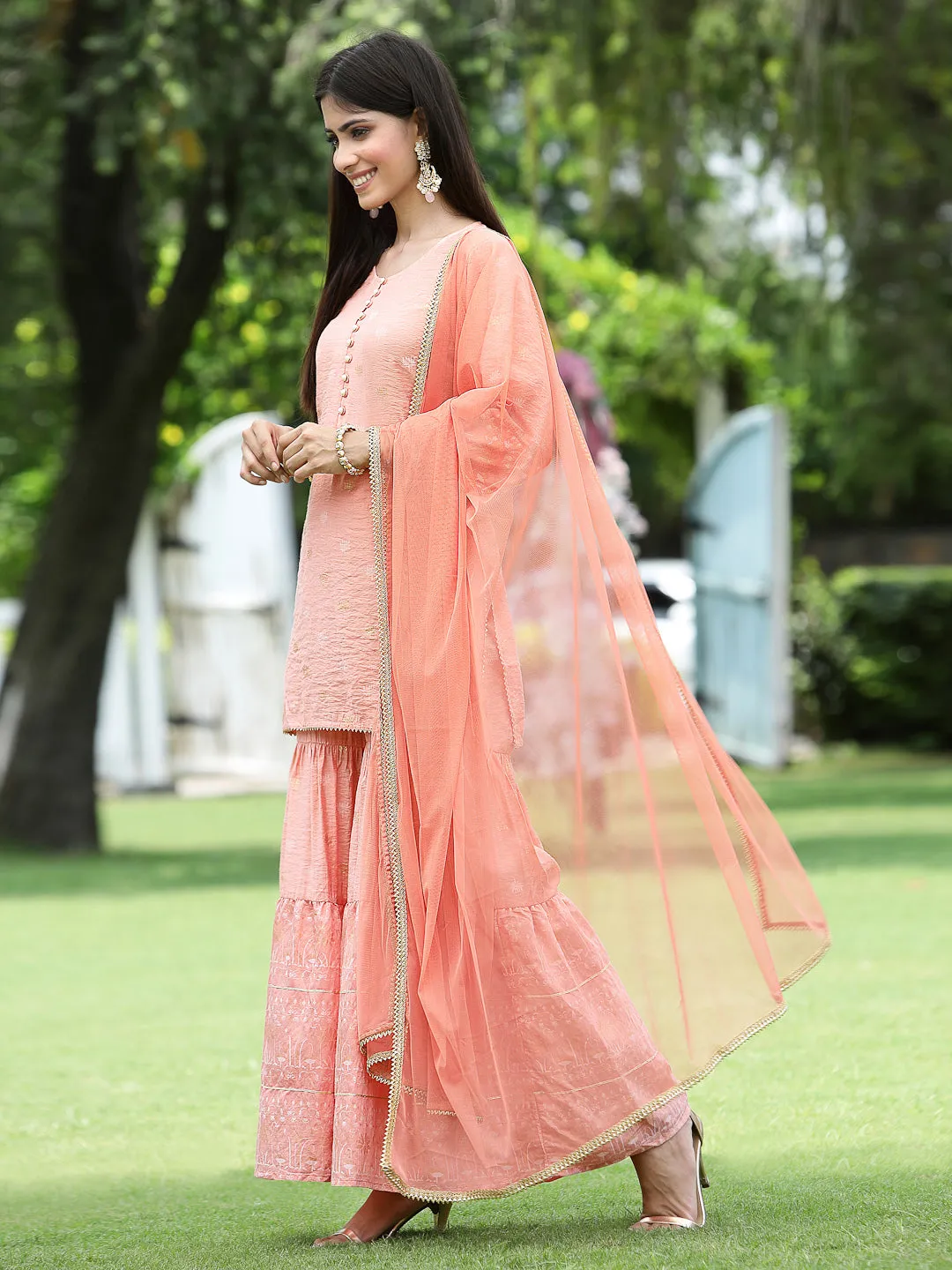 Juniper Peach Ethnic Motif Printed Viscose Muslin Kurta Sharara & Net Dupatta Set.