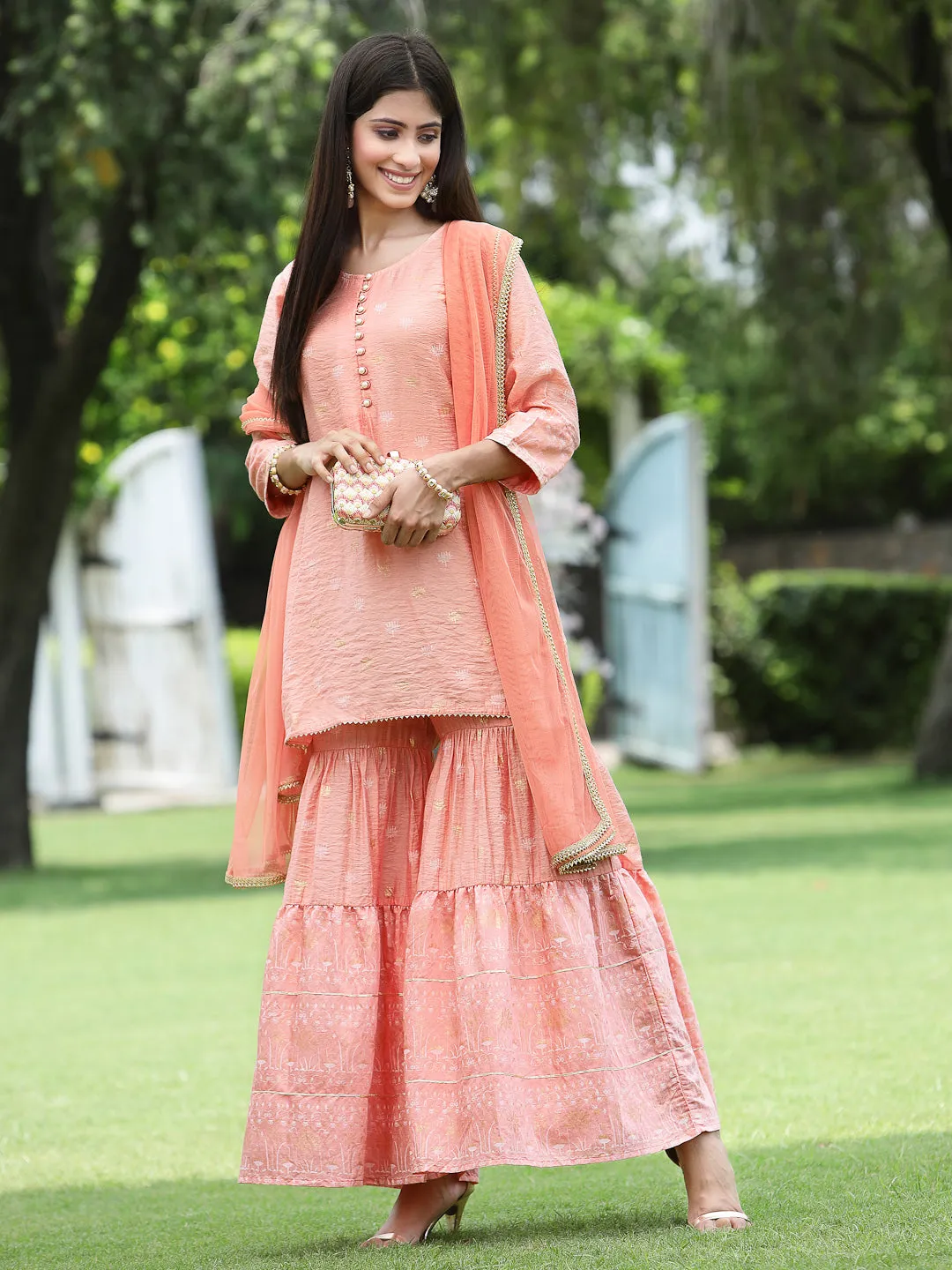 Juniper Peach Ethnic Motif Printed Viscose Muslin Kurta Sharara & Net Dupatta Set.